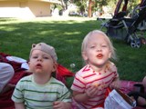Cousins eating Cheetos on a picnic